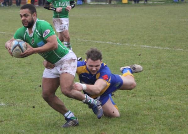 A brave tackle is put in to stop Sutton Coldfield's progress. Picture: Willie Whitesmith.