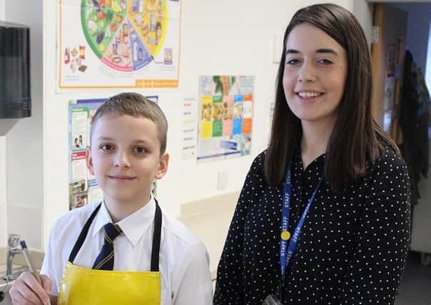 Cristian and catering teacher Carrie Daly.