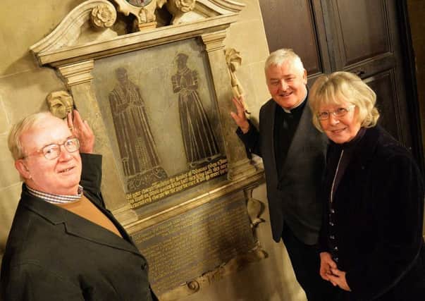 Clive Mason, the chairman of the Thomas Oken Charity with Dr Ann Thurley and the Rev Vaughan Roberts by the Thomas Oken plaque in St Mary's Church, Warwick.