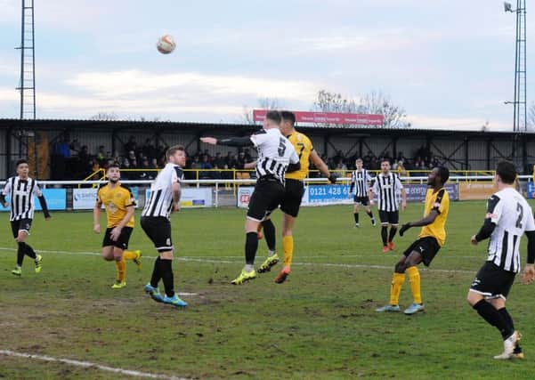 Courtney Baker-Richardson (partially obscured) heads home Leamington's opener from Richard Taundry's cross. Pictures: Morris Troughton