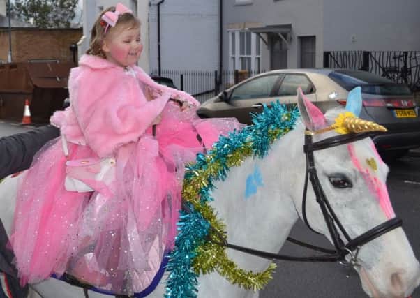 Nadia Bartnik rides a unicorn in Leamington.