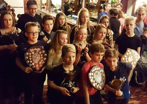 Swimmers with their silverware, enjoying the club's presentation evening