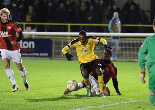 Ahmed Obeng goes down in the box under a challenge from Liam Bateman. Picture: Tim Nunan