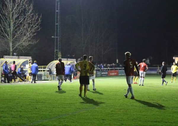 Play comes to a halt at the Phillips 66 Community Stadium as a section of the floodlights go out. Picture: Tim Nunan