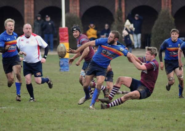 Danny Ruyssevelt slips a pass out of the tackle against Silhillians on Saturday.