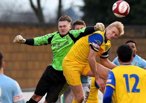 Goalkeeper Dan Jezeph punches clear in Saturday's 2-1 defeat by Spalding   PICTURES BY MARTIN PULLEY