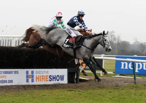 Vibrato Valtat and Sam Twiston-Davies lead Top Gamble and Paul Moloney over the last fence when winning the Kingmaker Novices' Steeplechase in 2015.