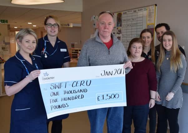 Garry Townsend-Kennedy and his family present his donation to the unit