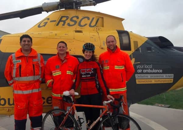 Helen Russell with an Air Ambulance Crew at Coventry Airport.