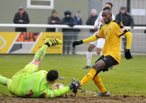 Ahmed Obeng is just beaten to the ball by Dorchester keeper Shane Murphy. Picture: Morris Troughton