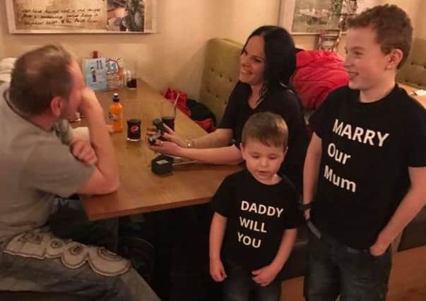Brooklyn Jackson and Riley Hartwell helping their mum Kelly Hartwell propose to her partner Andy Jackson at the Harvester in Warwick.