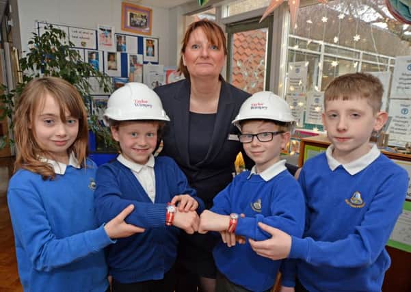 Some of the lucky pupils with their wrist watches