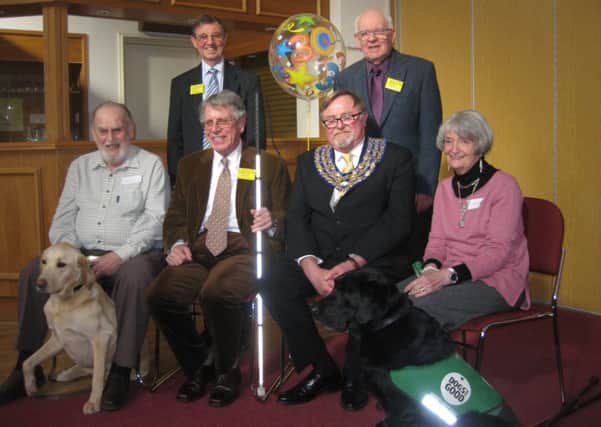 Volunteers and listeners of the Kenilworth Talking News with Kenilworth's mayor. Back row: Gerry Lawrence (Chairman) and John Denness (chief editor). Front row: Bob Beck with guide dog Fritz, Richard Bignell (Vice Chairman), Town mayor Cllr Richard Davies, and Marion Adcock with guide dog Cloud