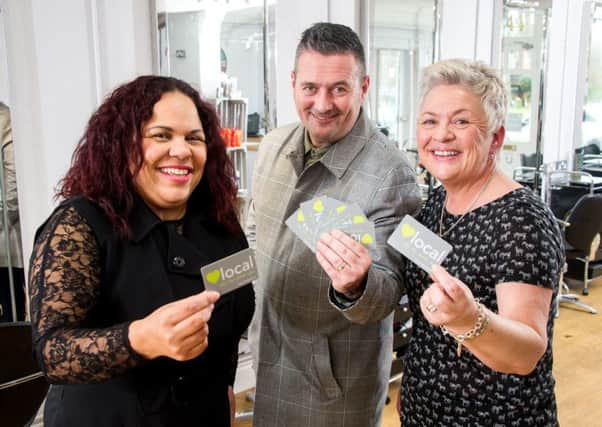 Pictured: Louise Fordham, Dave Hall & Jane Mozley, who have come together to help create a Rugby Loyalty card for the independent shops in the town. NNL-170228-223120009