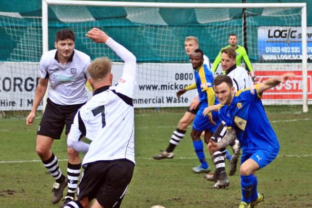 Connor Gudger goes in for a challenge with Ollie Snaith at Cambridge City last Saturday. Picture: Sally Ellis