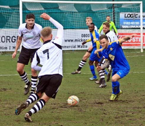 Connor Gudger goes in for a challenge with Ollie Snaith at Cambridge City last Saturday. Picture: Sally Ellis