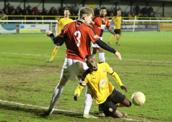 Ahmed Obeng goes down under the challenge of Jack Kelly to earn Brakes a second-half penalty. Picture: Tim Nunan