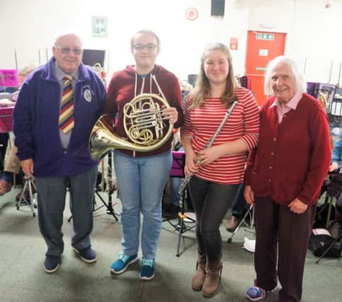 The youngest band members Diane Holland, 13 and Devon Reed, 13, with Des Mawby and Kath Wiltshire who are the oldest members.