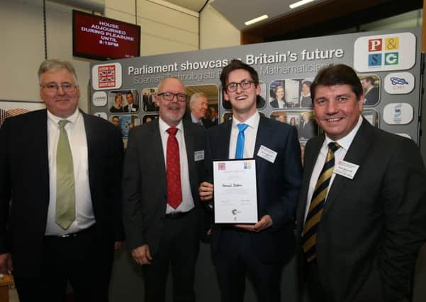 Sam Dalton receives his medal from from MP Stephen Metcalfe, Dr Stephen Benn, and the Royal Society of Chemistrys chief executive Dr Robert Parker.