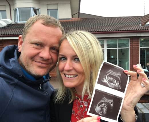 Sean and Natalie Casey with their scan photos of their twin girls Daisy and Georgie, who died after being born just 25 weeks into Natalie's pregnancy