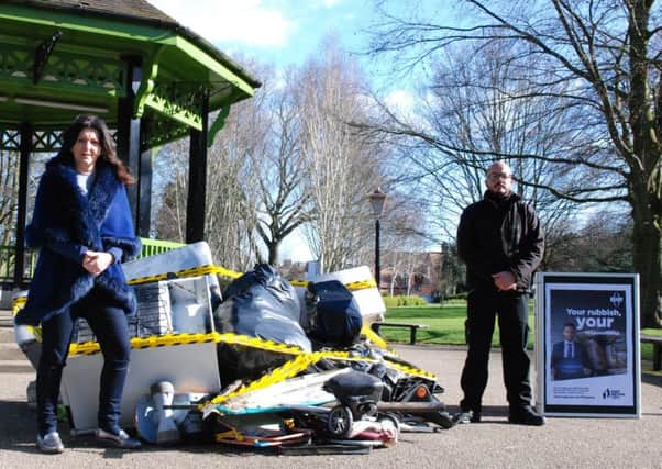 Rugby Borough Council portfolio holder for environment and public realm Lisa Parker and environmental enforcement officer Clinton Ramsey launch the #CrimeNotToCare campaign in Caldecott Park. Photo by Rugby Borough Council NNL-170321-144446001
