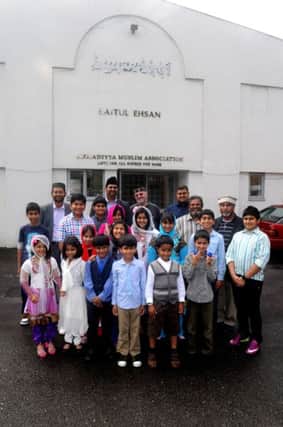 Members of the Leamington Spa branch of the Ahmadiyya Muslim Association .