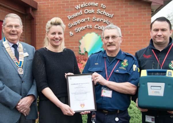 Left to right: John Taylor, president of Warwick Rotary Club, Kate Stevens, deputy head, Nick Shacklock, chairman of Warwick District Community First Responders and Paul Rowlands, co-ordinator of Warwick District Community First Responders.