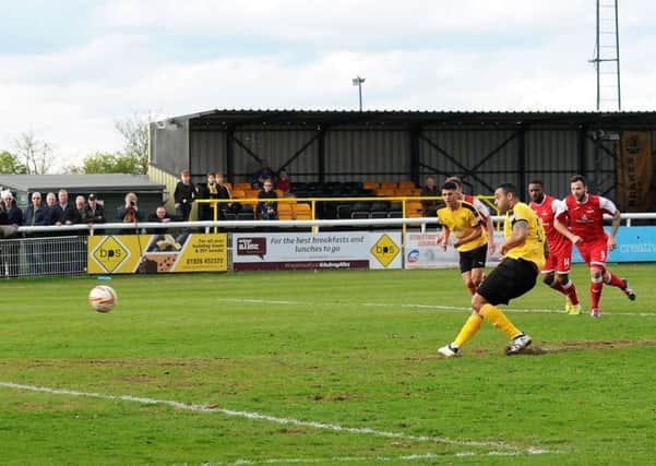 Stefan Moore steps up to take Brakes injury-time penalty. Pictures: Morris Troughton