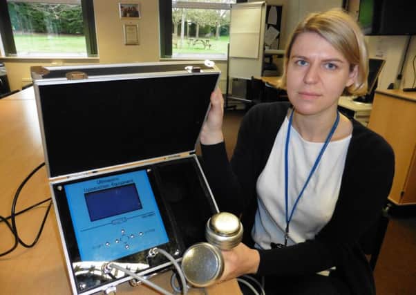 Warwickshire Trading Standards officer Eleanor Lake with one of the devices NNL-170404-125237001