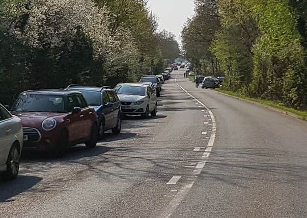 Cars parked all along Brinklow Road outside Coombe Abbey Country Park on Sunday. Photo: Warwickshire Police NNL-171204-121959001