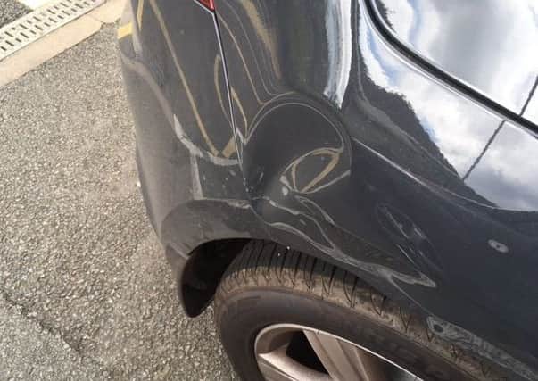 The damage to Val Stuart's car.