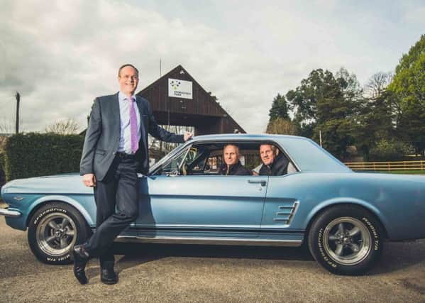 From left: Colin Hooper (estates director at Stoneleigh Park), Richard Clarke and Charlie Weetman (Kenilworth Show) with a classic Ford Mustang.