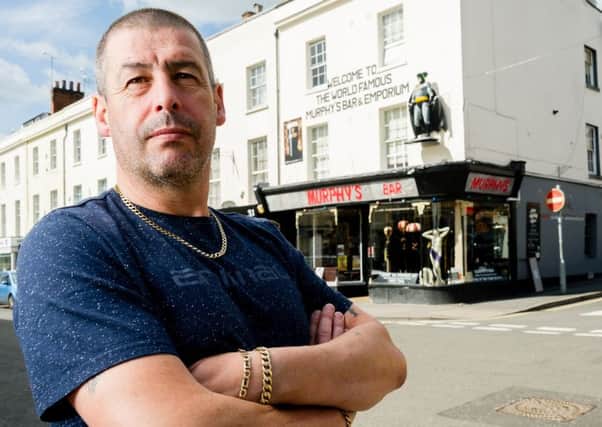 Owner Kevin Murphy is campaigning to keep the Batman statue up above the front window of the bar and to keep a number of other alterations he has made to the front of the building. NNL-170419-085313009