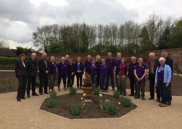 The Guy's Cliffe Walled Garden volunteers with members of the King Henry VIII Endowed Trust.
