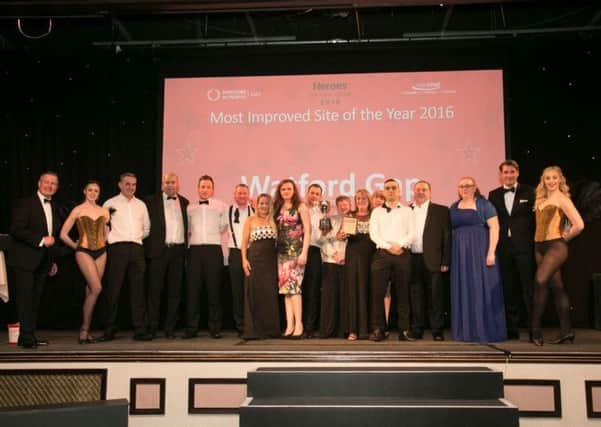 Employees of Roadchef's Watford Gap Services collect their award