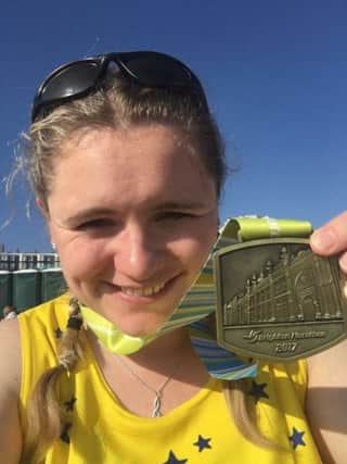 A very pleased Lottie Dronfield after completing the Brighton Marathon NNL-170805-111229001