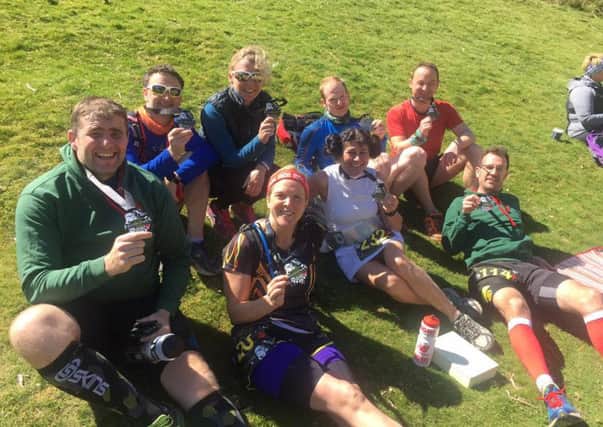 Spa Striders runners relax after completing the May the Fourth half-marathon. Picture submitted