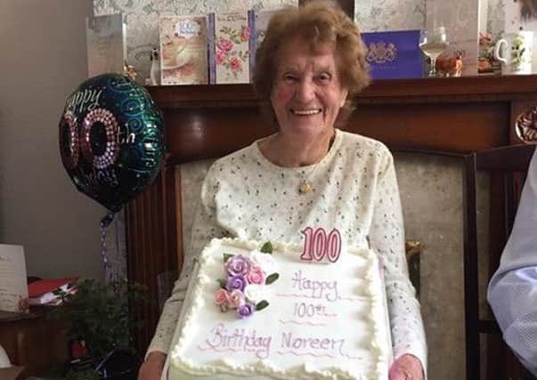 Noreen Utley with her cake for her 100th Birthday.