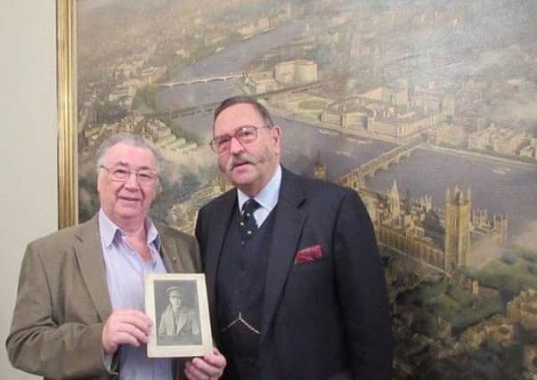 Curator Michael Naxton and Brian Iredale (left), who is holding a photograph of his war hero uncle..jpeg