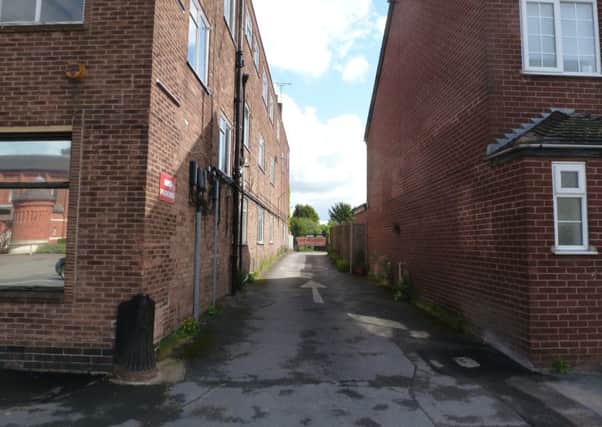 The narrow entrance to the site from Warwick Road.