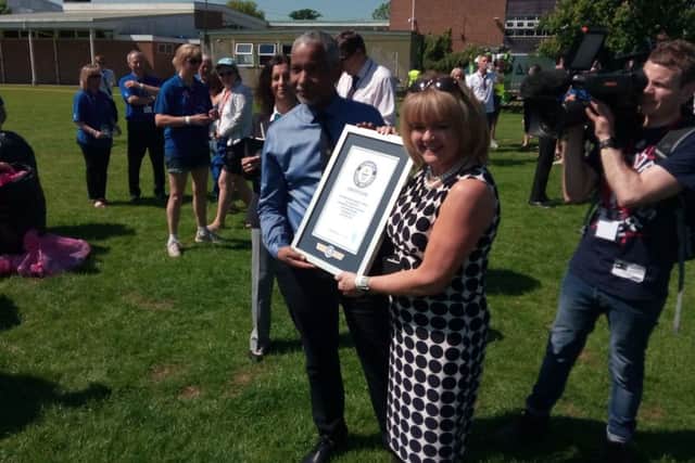 Headteacher of Kenilworth School Hayden Abbott (left) with the official Guinness World Record certificate