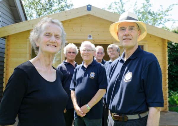 The new "Lions Den" behind Viv Morgan, co-founder of Northleigh House School, Warwick Lions president Geoff Wiskin, and Lions Peter Amis, Neil Chisholm, David Shore and Ken Hall.