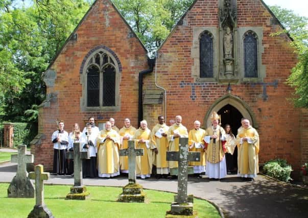 Altar servers with the Most Reverend Bernard Longley, Archbishop of Birmingham (third from right), Fr. Kevin Hooper, Parish Priest (far left), Deacon David Palmer  (fourth from right) and Fr. David Bazen, Priest in Residence (second from right) with concelebrating priests of the local Deanery following the Mass
