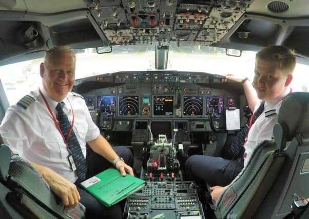 David Kempton (left), with son Alex Kempton in the cockpit. Credit: Chase Burns, Norwegian