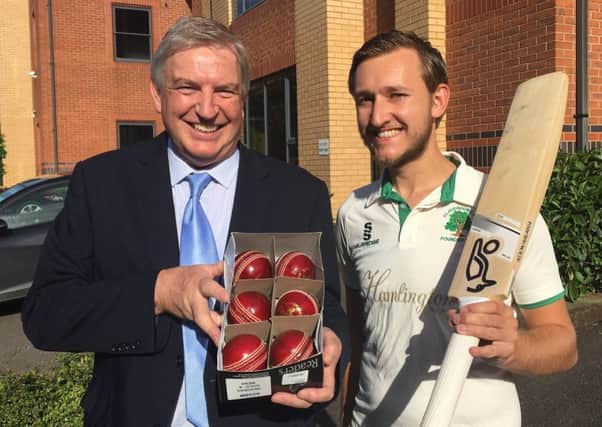 Tim Lester presents the six cricket balls to Claverdon's Stephen Fletcher.
