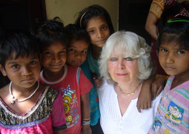 Rose Enstone with youngsters while she was helping at the Draram Raksha Welfare Society in Ludihana, India.