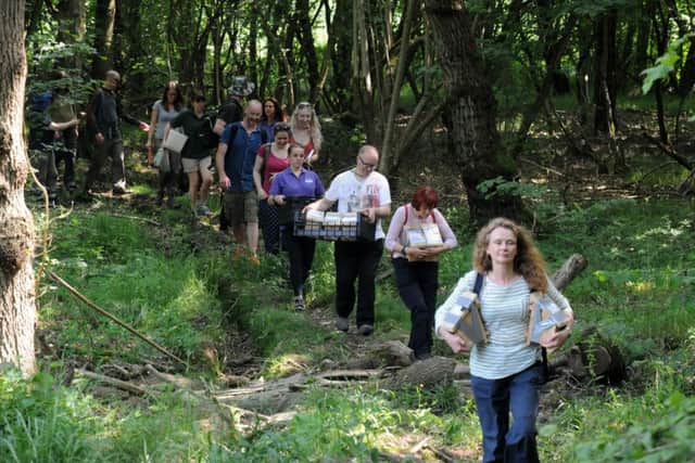Volunteers carry the dormice to their new homes. NNL-170620-221529009