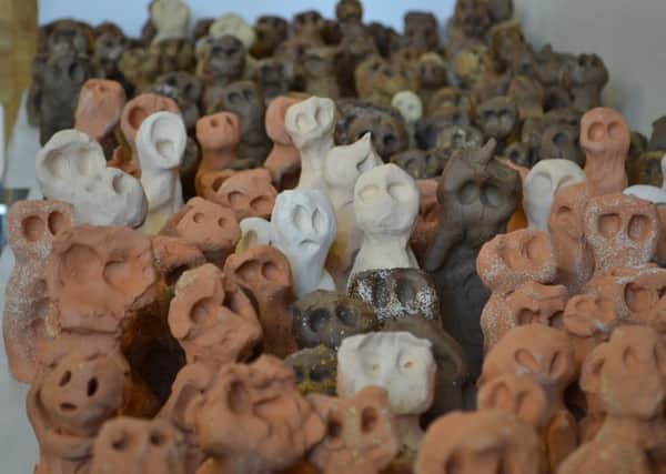 The clay figures that make up the installation