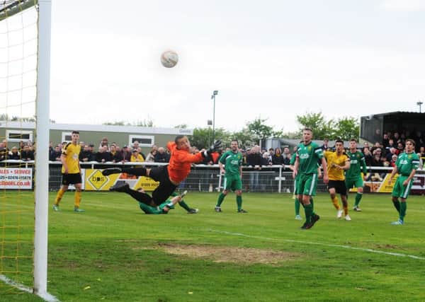 Courtney Baker-Richardson, seen here scoring a dramatic extra-time winner against Hitchin, has opted to remain at Leamington.