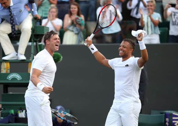 Marcus Willis and Jay Clarke celebrate their doubles win over Pierre-Hugues Herbert and Nicolas Mahut.
